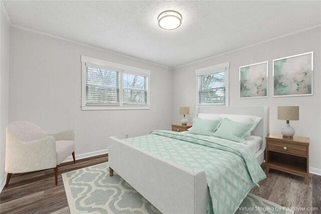 1573 Deerwood Ln, Acworth, GA 30102 - bedroom featuring hardwood / wood-style floors, crown molding, and a textured ceiling