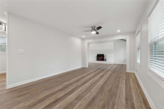 1573 Deerwood Ln, Acworth, GA 30102 - unfurnished living room featuring hardwood / wood-style floors and ceiling fan