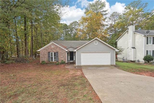 view of front of house featuring a front yard and a garage