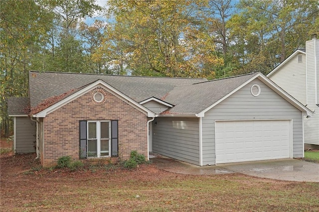 single story home featuring a garage and a front lawn