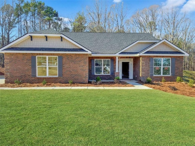 craftsman-style house with a front lawn and brick siding