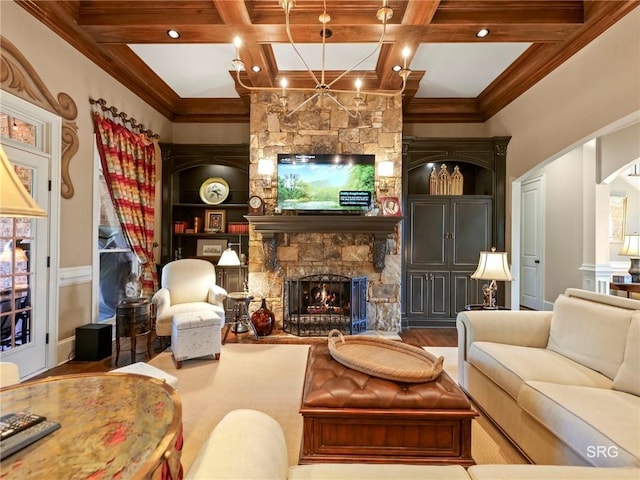 living area featuring a fireplace, coffered ceiling, and beamed ceiling