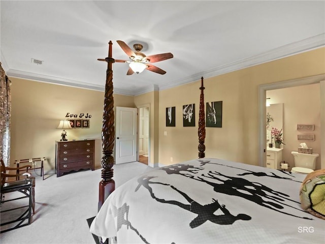 bedroom featuring crown molding, light colored carpet, visible vents, a ceiling fan, and ensuite bath