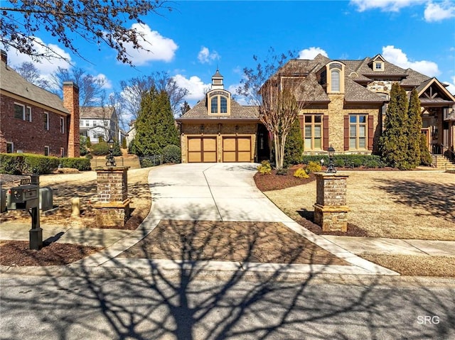 view of front facade featuring a garage, concrete driveway, and brick siding