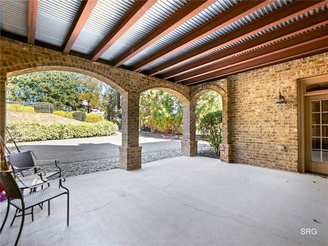 view of patio / terrace featuring fence