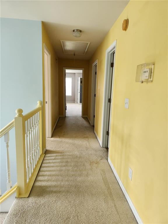 1441 Saint George Pl, Conyers, GA 30012 - corridor with attic access, light colored carpet, and an upstairs landing