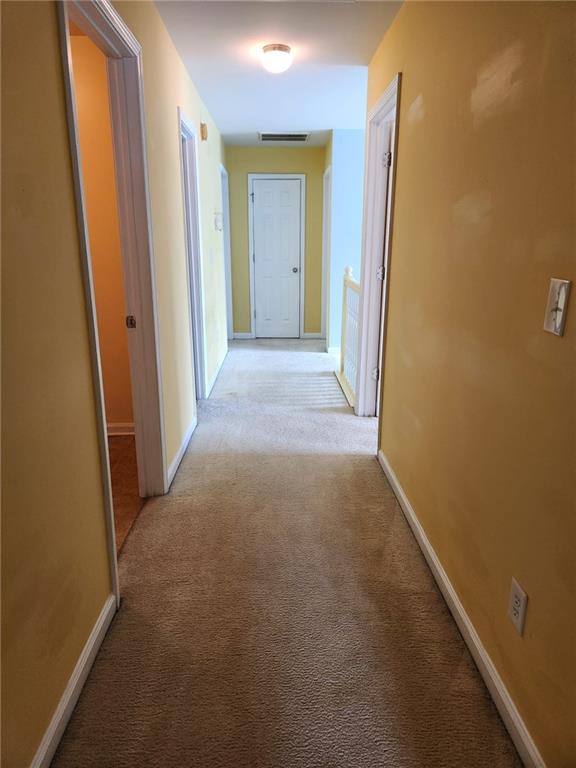 1441 Saint George Pl, Conyers, GA 30012 - corridor with light carpet