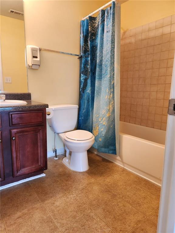 1441 Saint George Pl, Conyers, GA 30012 - full bath with vanity, shower / bath combo, and tile patterned floors