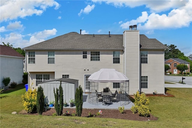 1441 Saint George Pl, Conyers, GA 30012 - back of property with a gazebo, a lawn, a patio area, and a chimney