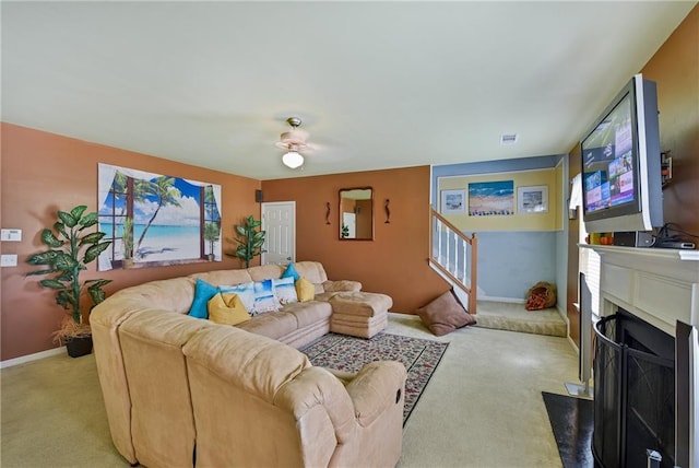 1441 Saint George Pl, Conyers, GA 30012 - living room featuring light colored carpet, stairway, and a fireplace with flush hearth