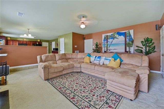 1441 Saint George Pl, Conyers, GA 30012 - carpeted living room featuring a chandelier and baseboards