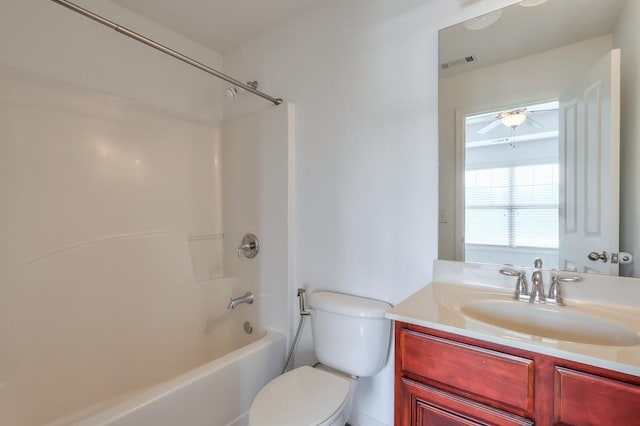 full bathroom featuring toilet, visible vents, tub / shower combination, and vanity