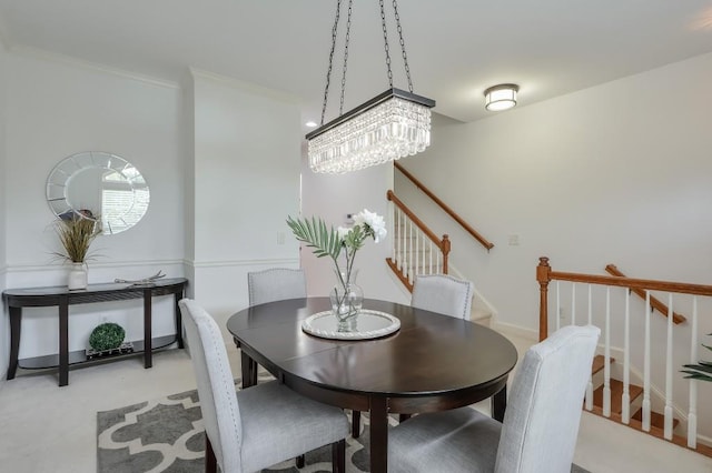 dining space with stairway and ornamental molding