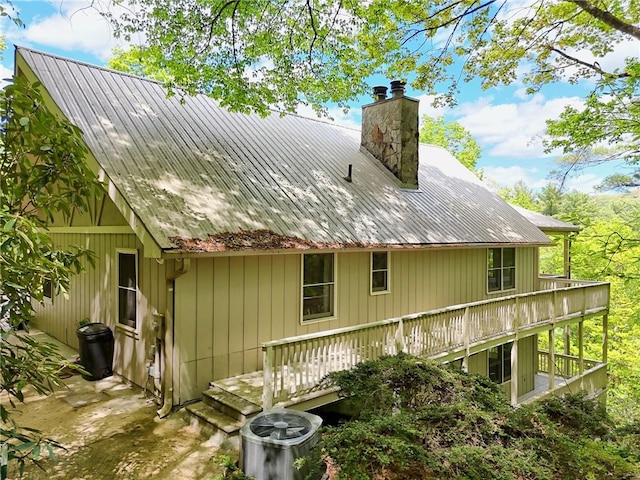 1133 Ridgepole Dr, Sky Valley, GA 30537 - rear view of property with a chimney, a metal roof, and a deck