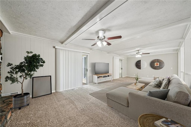 2466 Country Club Dr, Conyers, GA 30013 - carpeted living area featuring a textured ceiling, ceiling fan, and beamed ceiling