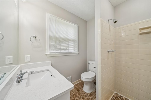 2466 Country Club Dr, Conyers, GA 30013 - full bathroom with vanity, tiled shower, and a textured ceiling