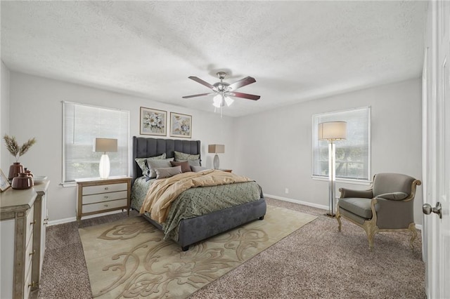 2466 Country Club Dr, Conyers, GA 30013 - carpeted bedroom with multiple windows, a ceiling fan, and a textured ceiling