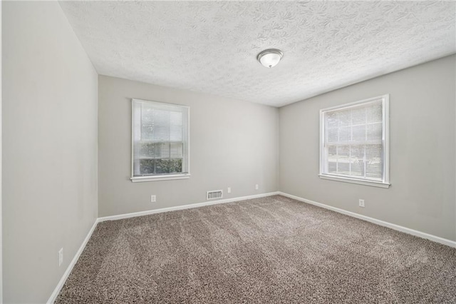 2466 Country Club Dr, Conyers, GA 30013 - spare room with carpet flooring and a textured ceiling