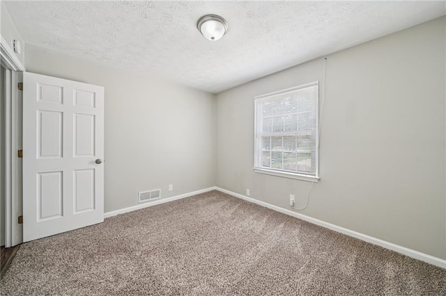 2466 Country Club Dr, Conyers, GA 30013 - carpeted spare room featuring baseboards and a textured ceiling