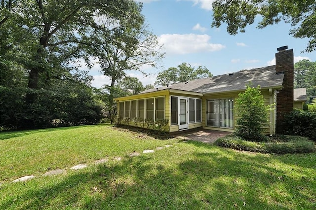 2466 Country Club Dr, Conyers, GA 30013 - view of green lawn featuring a sunroom and a patio area