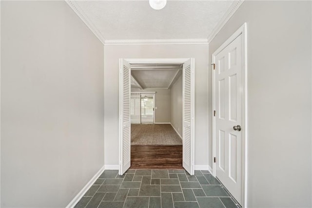 2466 Country Club Dr, Conyers, GA 30013 - hall with ornamental molding, dark stone finish floors, and a textured ceiling