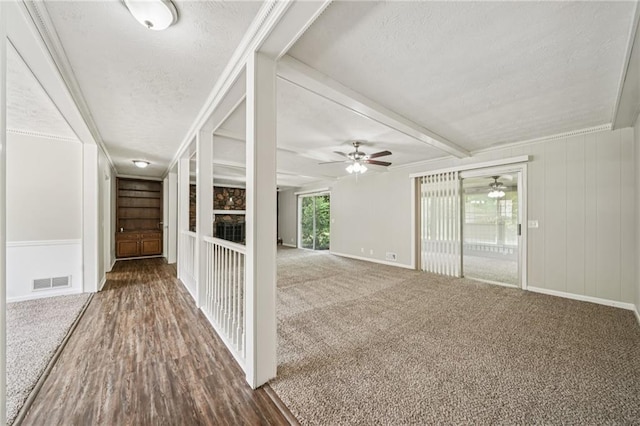 2466 Country Club Dr, Conyers, GA 30013 - hall with a textured ceiling, carpet floors, beamed ceiling, and built in features