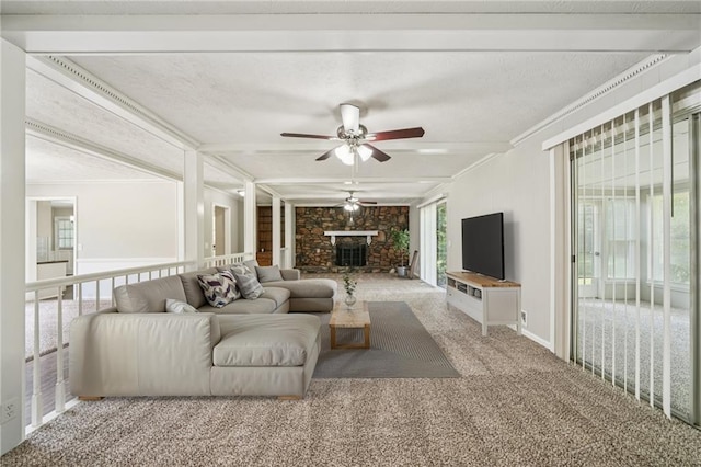 2466 Country Club Dr, Conyers, GA 30013 - living room featuring ornamental molding, ceiling fan, a fireplace, and carpet floors