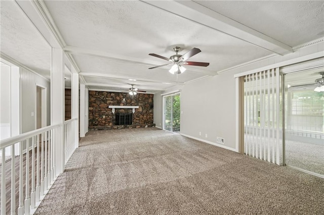 2466 Country Club Dr, Conyers, GA 30013 - unfurnished living room featuring a ceiling fan, a textured ceiling, carpet flooring, a stone fireplace, and beamed ceiling
