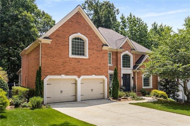 290 Edwardton Ct, Roswell, GA 30076 - view of front of house featuring brick siding, driveway, an attached garage, and a front lawn