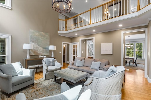 290 Edwardton Ct, Roswell, GA 30076 - living area with a chandelier, a high ceiling, wood finished floors, ornamental molding, and recessed lighting