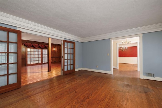 unfurnished room with hardwood / wood-style floors and ornamental molding