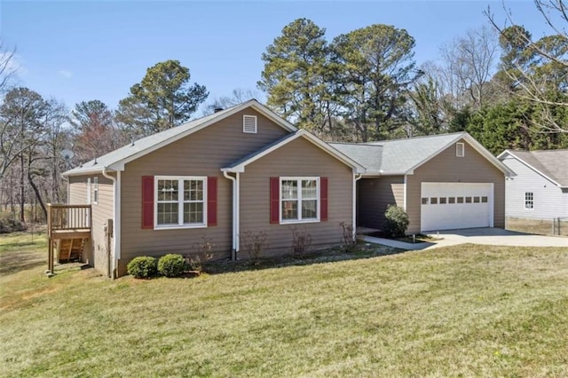 ranch-style house featuring an attached garage, driveway, and a front lawn