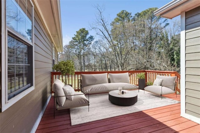 wooden deck featuring an outdoor living space