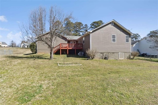 back of property with central AC, a yard, stairway, and a wooden deck