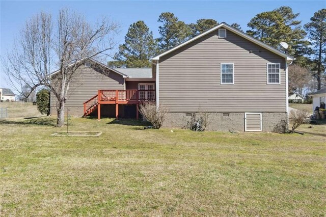 view of home's exterior featuring crawl space, stairs, a deck, and a yard