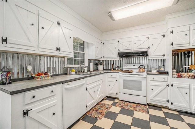 kitchen with a textured ceiling, sink, white appliances, and white cabinetry