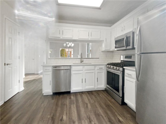 kitchen with white cabinets, stainless steel appliances, and sink