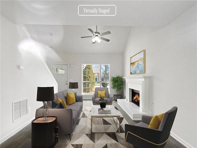 living room featuring ceiling fan, dark hardwood / wood-style flooring, and vaulted ceiling