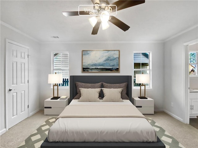 bedroom featuring ceiling fan, crown molding, light carpet, and multiple windows