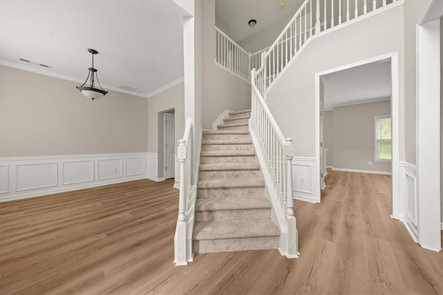2870 Tattersall Ct, Cumming, GA 30041 - staircase with crown molding and wood finished floors