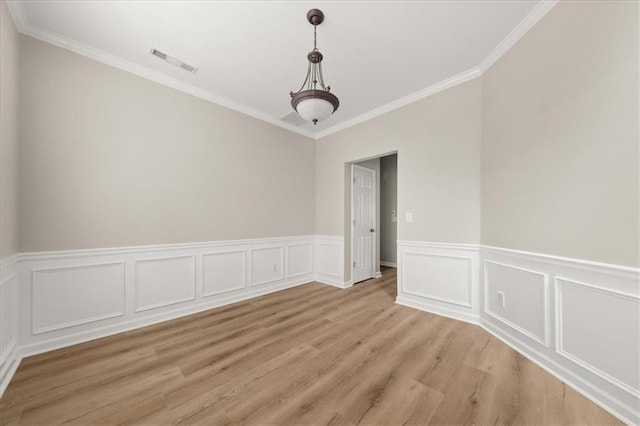 2870 Tattersall Ct, Cumming, GA 30041 - unfurnished dining area with ornamental molding, light wood-type flooring, and a wainscoted wall