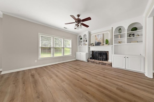 2870 Tattersall Ct, Cumming, GA 30041 - unfurnished living room with ornamental molding, a ceiling fan, a fireplace, wood finished floors, and baseboards