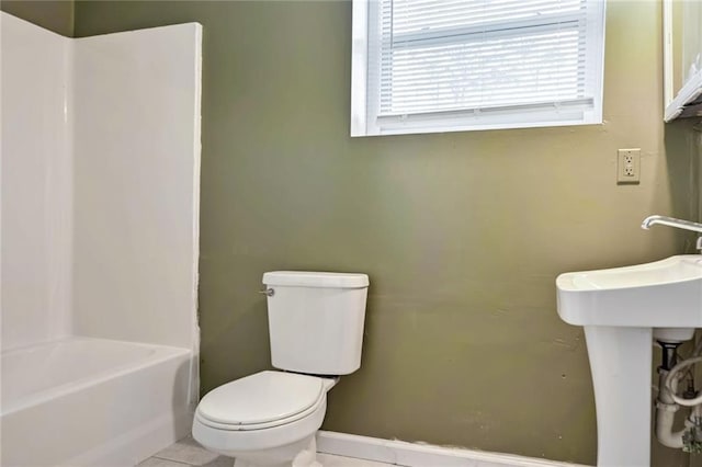 bathroom featuring tile patterned floors and toilet