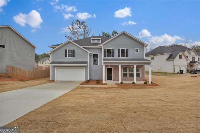 250 Stonecreek Pkwy, Covington, GA 30016 - traditional-style house featuring concrete driveway, a porch, a garage, and brick siding