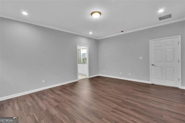 250 Stonecreek Pkwy, Covington, GA 30016 - spare room featuring ornamental molding, dark wood finished floors, and recessed lighting