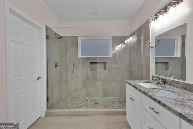 250 Stonecreek Pkwy, Covington, GA 30016 - full bathroom with a shower stall, vanity, and tile patterned floors
