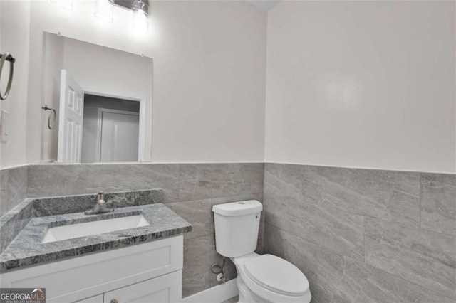 250 Stonecreek Pkwy, Covington, GA 30016 - half bath with vanity, tile walls, and wainscoting