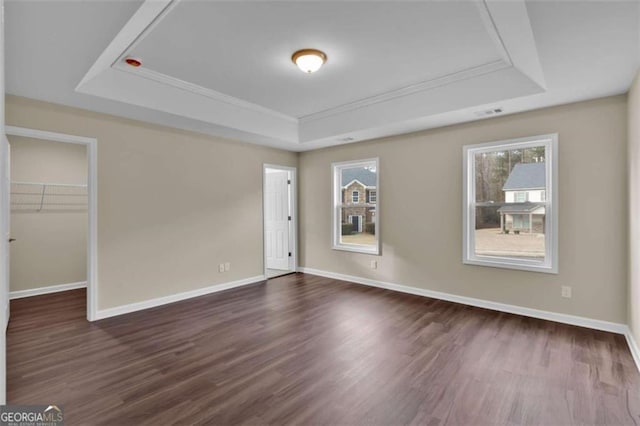 250 Stonecreek Pkwy, Covington, GA 30016 - unfurnished room featuring a raised ceiling, dark wood-type flooring, and crown molding