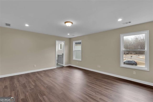 250 Stonecreek Pkwy, Covington, GA 30016 - empty room with healthy amount of natural light, dark wood finished floors, and recessed lighting