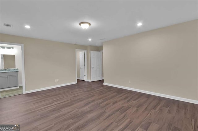 250 Stonecreek Pkwy, Covington, GA 30016 - unfurnished room with dark wood-type flooring and recessed lighting